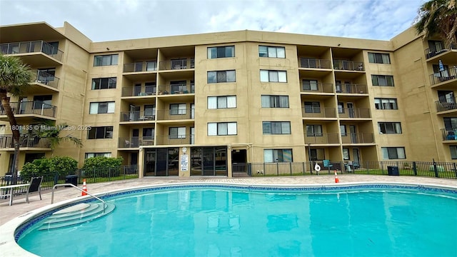 301 Golden Isles Dr Unit 203, Hallandale Beach, FL 33009 - community pool featuring fence