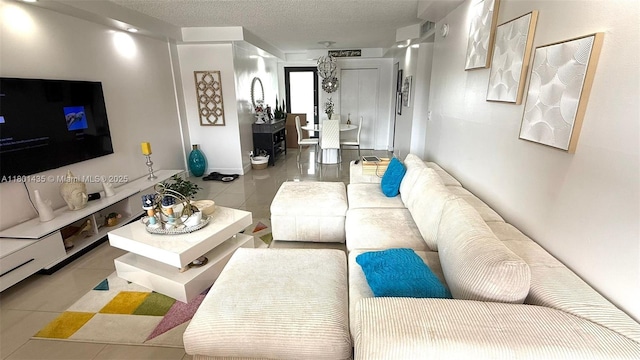 living room featuring tile patterned floors and a textured ceiling