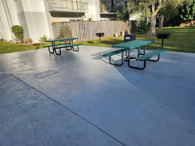 view of home's community with a patio area and outdoor dining space