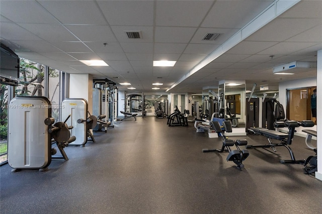workout area with a paneled ceiling