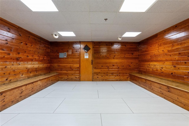 tiled empty room with wooden walls