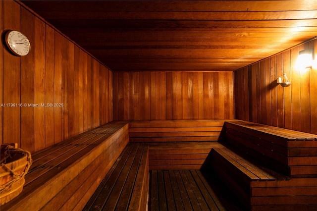 relaxing sauna with wood ceiling and wood walls