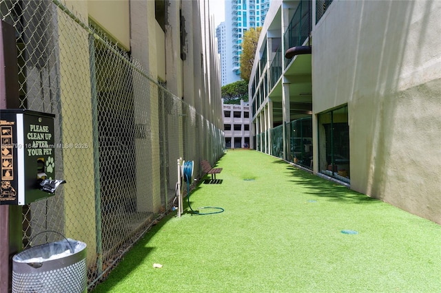 view of home's community with fence
