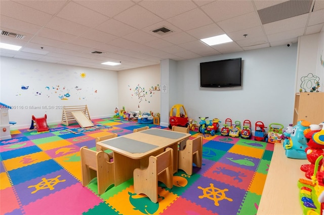 game room featuring a paneled ceiling