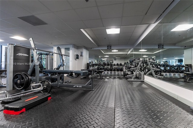gym featuring a paneled ceiling