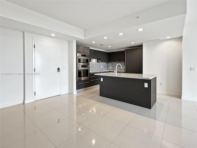 7875 NW 107th Ave Unit 306, Doral, FL 33178 - kitchen with modern cabinets, recessed lighting, light countertops, light tile patterned floors, and tasteful backsplash
