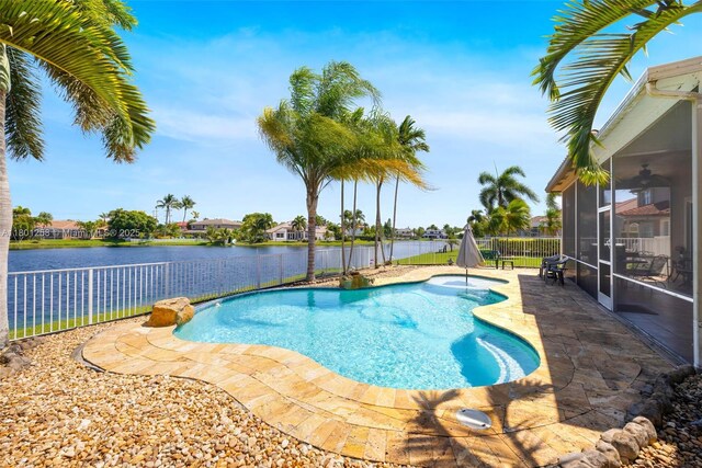 16343 Segovia Cir S, Pembroke Pines, FL 33331 - view of pool with a fenced backyard, a sunroom, a patio, ceiling fan, and a water view