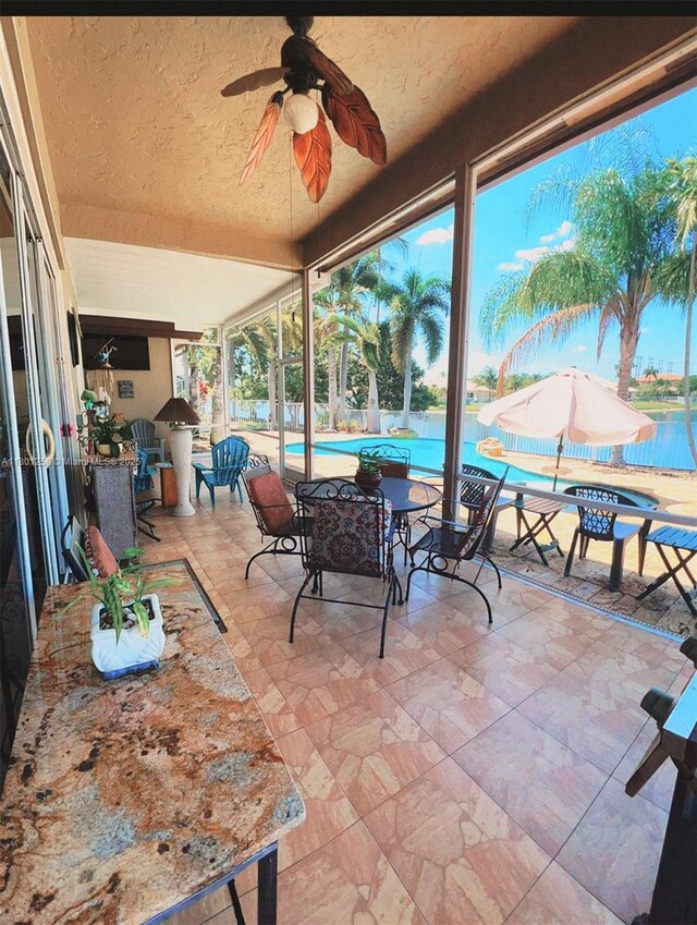 16343 Segovia Cir S, Pembroke Pines, FL 33331 - view of patio / terrace with an outdoor pool and ceiling fan