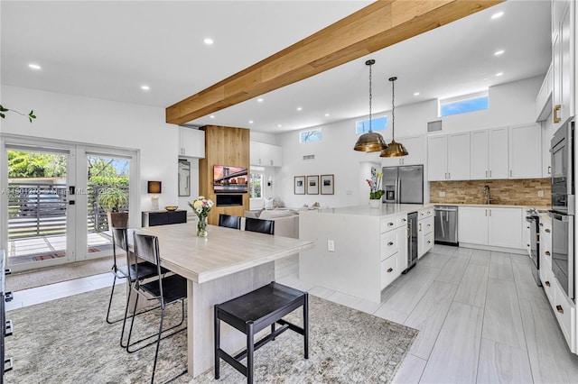 2801 SW 64th Ave, Miami, FL 33155 - kitchen with stainless steel appliances, recessed lighting, wine cooler, a kitchen island, and backsplash