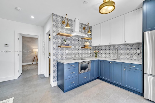 2801 SW 64th Ave, Miami, FL 33155 - kitchen featuring open shelves, stainless steel appliances, blue cabinetry, light countertops, and custom exhaust hood
