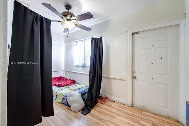 3050 NW 22nd Ct, Miami, FL 33142 - bedroom with wood finished floors and ceiling fan