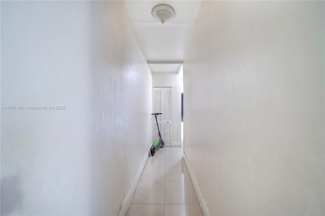 3050 NW 22nd Ct, Miami, FL 33142 - hallway featuring light tile patterned floors and baseboards