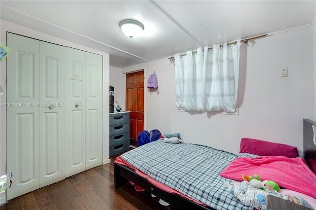 3050 NW 22nd Ct, Miami, FL 33142 - bedroom featuring dark wood-style floors and a closet