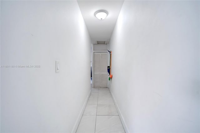 3050 NW 22nd Ct, Miami, FL 33142 - hall with baseboards and light marble finish flooring
