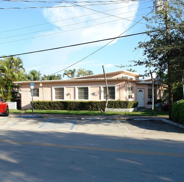 1795 SW Calais Dr Unit 1, Miami Beach, FL 33141 - view of front of home with uncovered parking and stucco siding