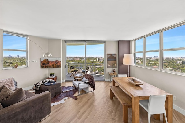 2475 Brickell Ave Unit 2002, Miami, FL 33129 - living area with healthy amount of natural light, light wood-style floors, and baseboards