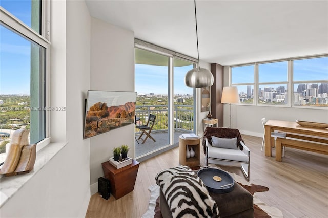 2475 Brickell Ave Unit 2002, Miami, FL 33129 - sitting room featuring a city view, wood finished floors, and baseboards