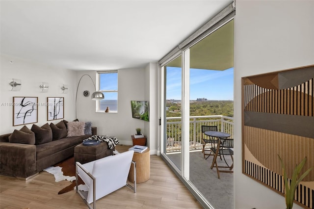 2475 Brickell Ave Unit 2002, Miami, FL 33129 - living area with light wood-style flooring, baseboards, and a wall of windows