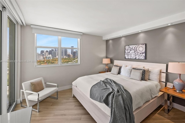2475 Brickell Ave Unit 2002, Miami, FL 33129 - bedroom with baseboards and a city view