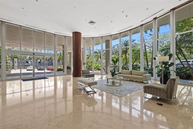 2475 Brickell Ave Unit 2002, Miami, FL 33129 - common area featuring a towering ceiling and expansive windows