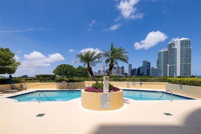 2475 Brickell Ave Unit 2002, Miami, FL 33129 - community pool featuring a patio area and a skyline view