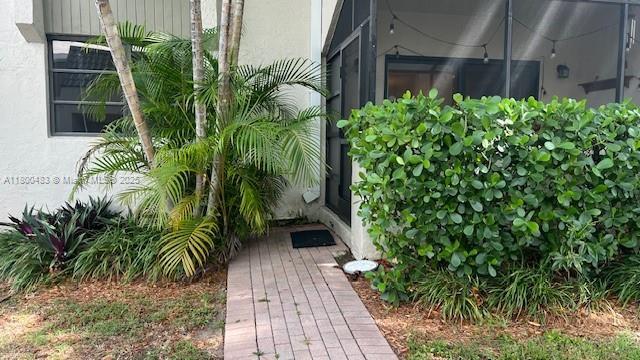 entrance to property featuring stucco siding