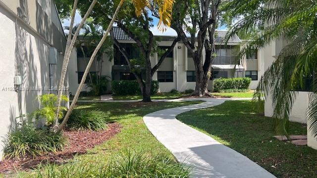 view of home's community with a yard