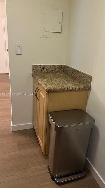 detailed view of baseboards and wood finished floors
