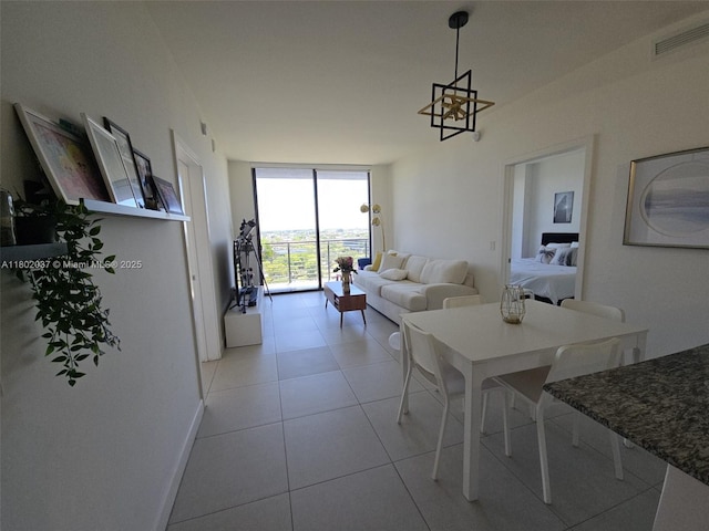 5350 NW 84th Ave Unit 1207, Doral, FL 33166 - dining area with expansive windows, light tile patterned floors, and a chandelier