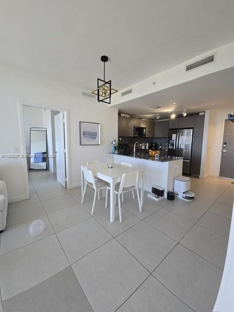 5350 NW 84th Ave Unit 1207, Doral, FL 33166 - dining room with light tile patterned floors and baseboards