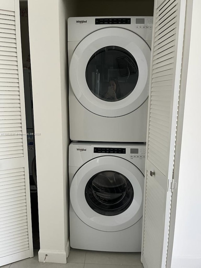 5350 NW 84th Ave Unit 1207, Doral, FL 33166 - laundry room with stacked washer / dryer and light tile patterned floors