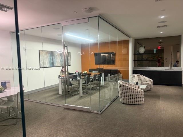5350 NW 84th Ave Unit 1207, Doral, FL 33166 - carpeted dining space with a sink