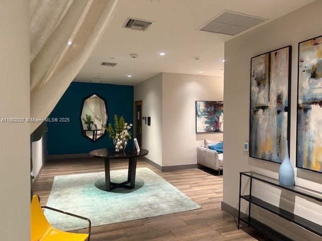 5350 NW 84th Ave Unit 1207, Doral, FL 33166 - hallway featuring wood finished floors, recessed lighting, and baseboards