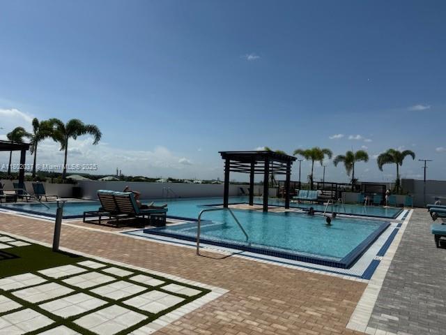 5350 NW 84th Ave Unit 1207, Doral, FL 33166 - community pool featuring a patio