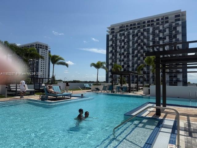 5350 NW 84th Ave Unit 1207, Doral, FL 33166 - community pool with a patio
