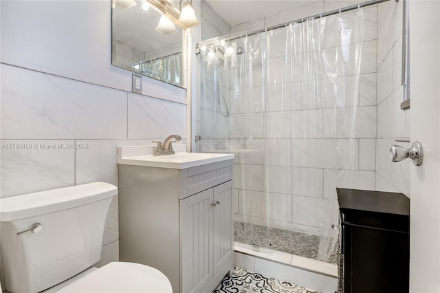 6345 Collins Ave Unit 522, Miami Beach, FL 33141 - full bath featuring tile walls, toilet, tiled shower, and vanity