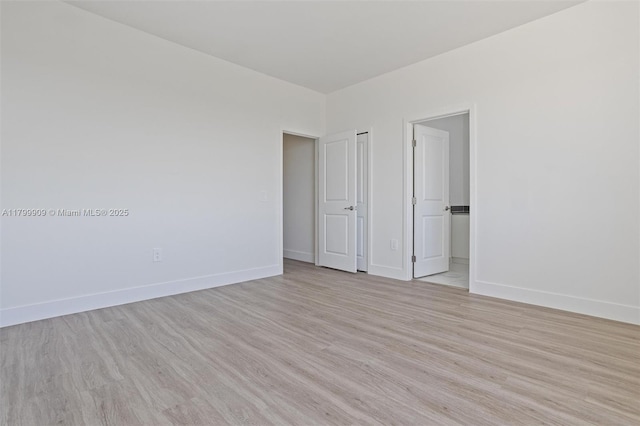 18953 SW 344th Ter, Homestead, FL 33034 - empty room with light wood finished floors and baseboards