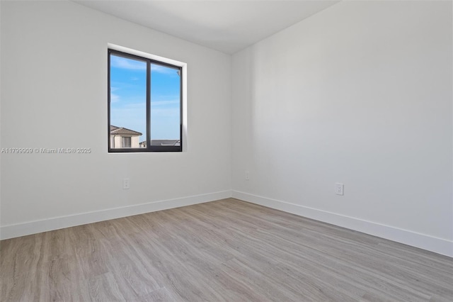 18953 SW 344th Ter, Homestead, FL 33034 - empty room with baseboards and wood finished floors