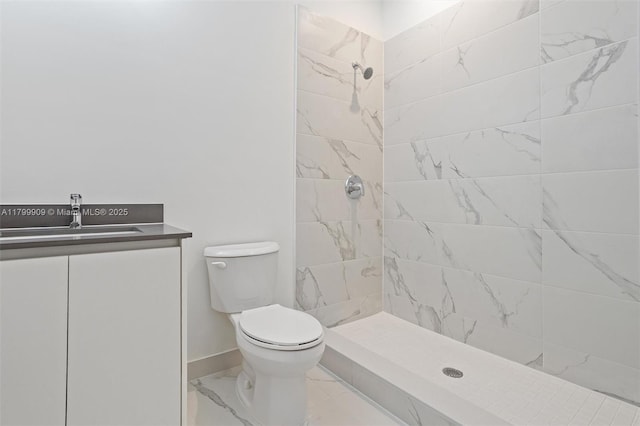 18953 SW 344th Ter, Homestead, FL 33034 - full bathroom featuring marble finish flooring, toilet, a tile shower, vanity, and baseboards
