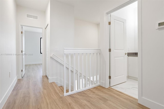 18953 SW 344th Ter, Homestead, FL 33034 - hallway featuring an upstairs landing, wood finished floors, and baseboards