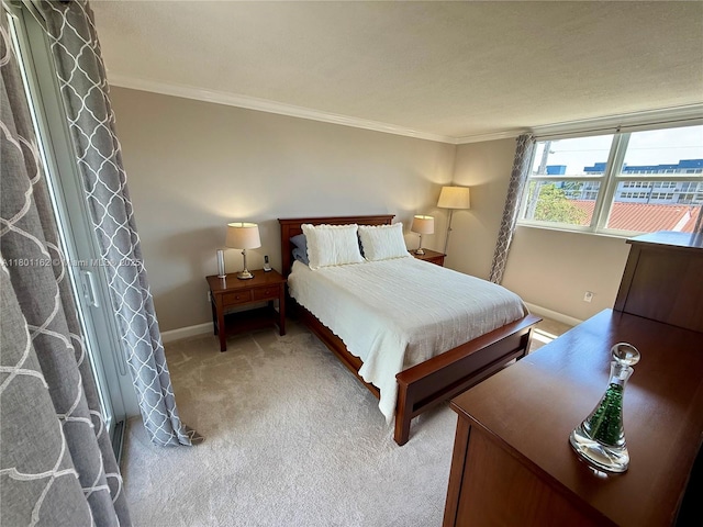 16518 NE 26th Ave Unit 405, North Miami Beach, FL 33160 - bedroom with baseboards, ornamental molding, and light colored carpet