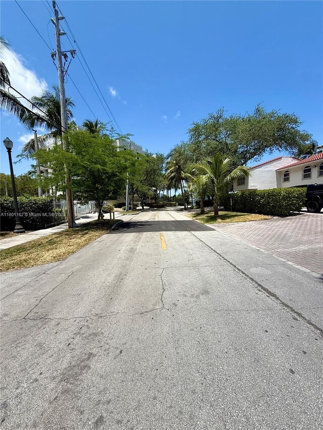 16518 NE 26th Ave Unit 405, North Miami Beach, FL 33160 - view of asphalt road featuring street lighting