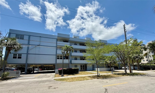 16518 NE 26th Ave Unit 405, North Miami Beach, FL 33160 - view of property featuring uncovered parking