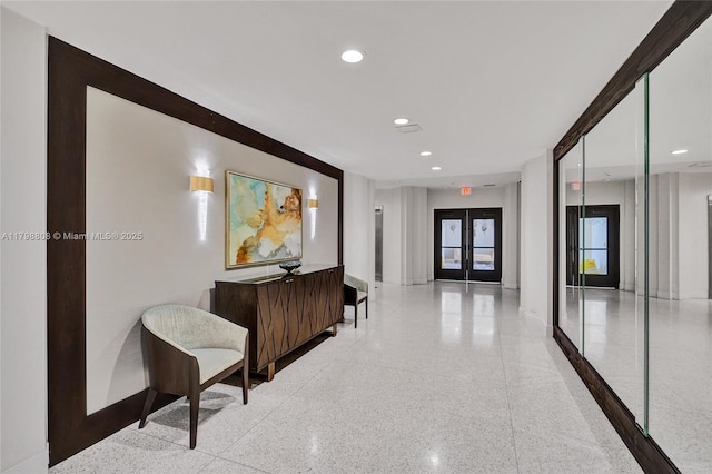 hallway featuring french doors, recessed lighting, and baseboards