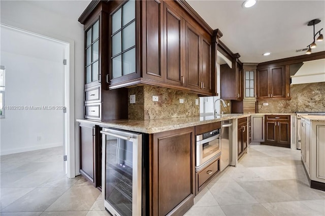 1911 NE 206th Ter, Miami, FL 33179 - kitchen featuring beverage cooler, custom range hood, light stone countertops, backsplash, and light tile patterned floors