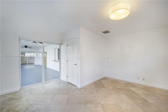 1911 NE 206th Ter, Miami, FL 33179 - unfurnished room with a ceiling fan, baseboards, and light tile patterned floors