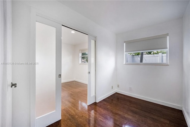 1911 NE 206th Ter, Miami, FL 33179 - unfurnished room featuring dark wood finished floors, baseboards, and recessed lighting