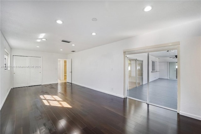 1911 NE 206th Ter, Miami, FL 33179 - unfurnished bedroom with a closet, baseboards, wood finished floors, and recessed lighting