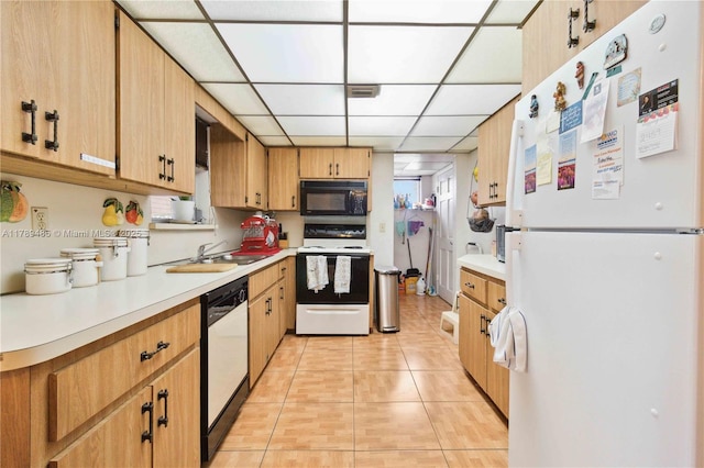 2730 SW 66th Ter, Miramar, FL 33023 - kitchen with white appliances, light tile patterned floors, light countertops, a sink, and a drop ceiling