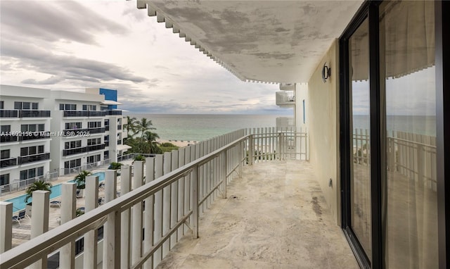 6061 Collins Ave Unit 7D, Miami Beach, FL 33140 - balcony featuring a water view and view of pool area